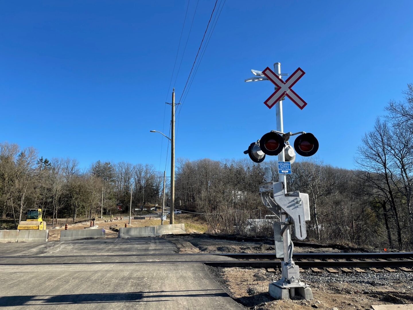 Technician testing railway signal equipment